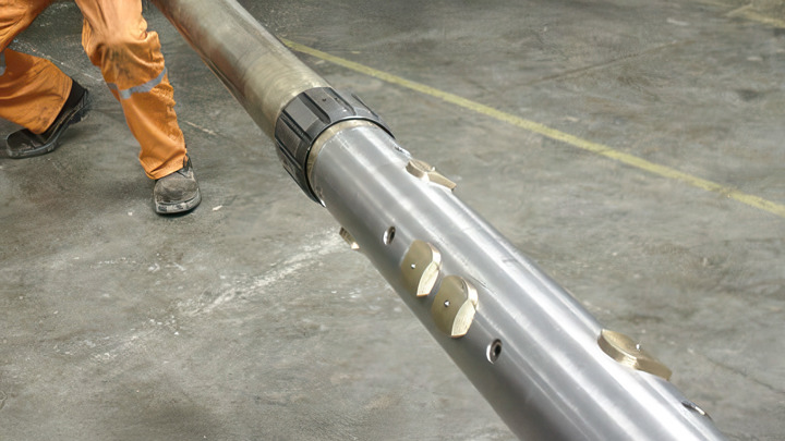 Tool assembly prepared for recovering a damaged straddle packer, shown on the rig floor before deployment.