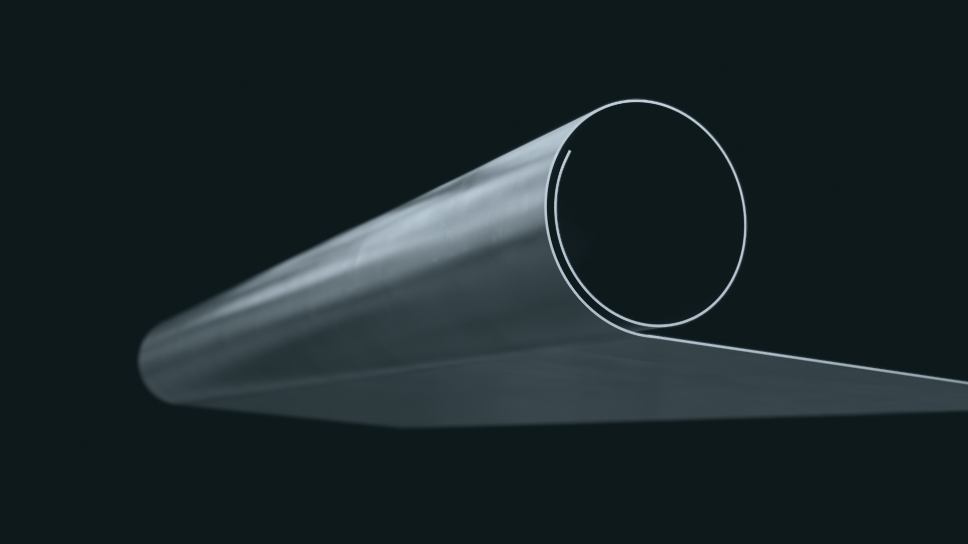 Close-up of a Welltec tool showcasing its cylindrical shape with a smooth, metallic surface. The image emphasizes the tools precision and sleek design