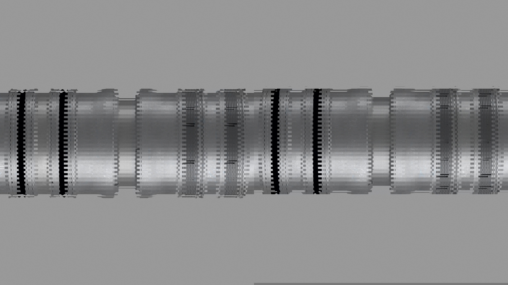 3D rendering of a Welltec downhole tool showing precision grooves and seals for zonal isolation and wellbore sealing.
