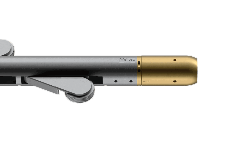 Coiled Tubing Well Tractor tool with a metallic body and gold-colored end piece, designed for precise downhole interventions.